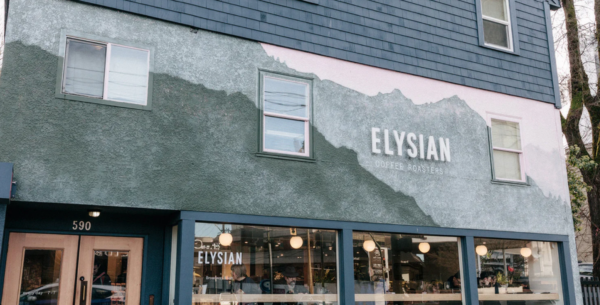 The Elysian cafe at Broadway & Ash, with the painted mountain mural across the building