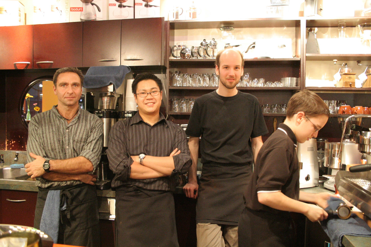 The Elysian team behind the bar at the first cafe, on West 5th Avenue